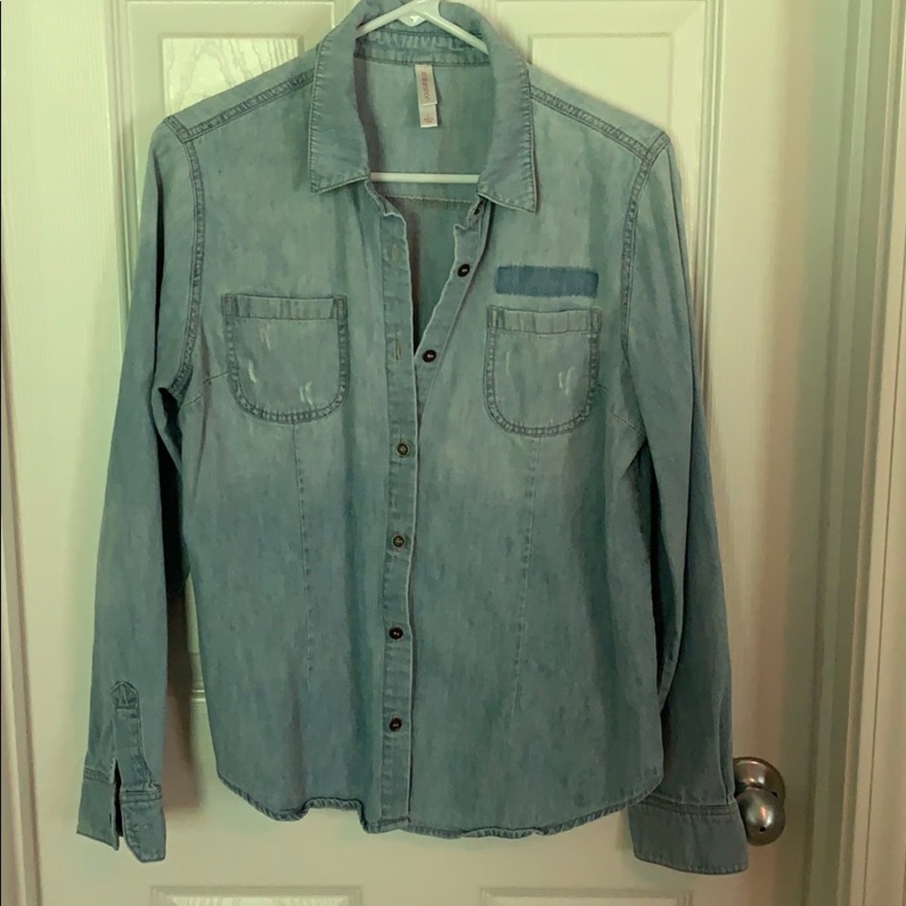 Long sleeve, distressed denim button down shirt.